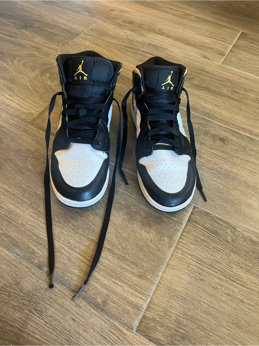 Nike Black White and Gold Air Jordan 1 high-top sneakers